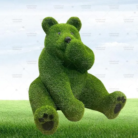 МЕДВЕДЬ сидячий сосет лапу